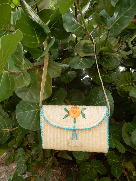 Thatch Clutch with orange flower + blue straw piping