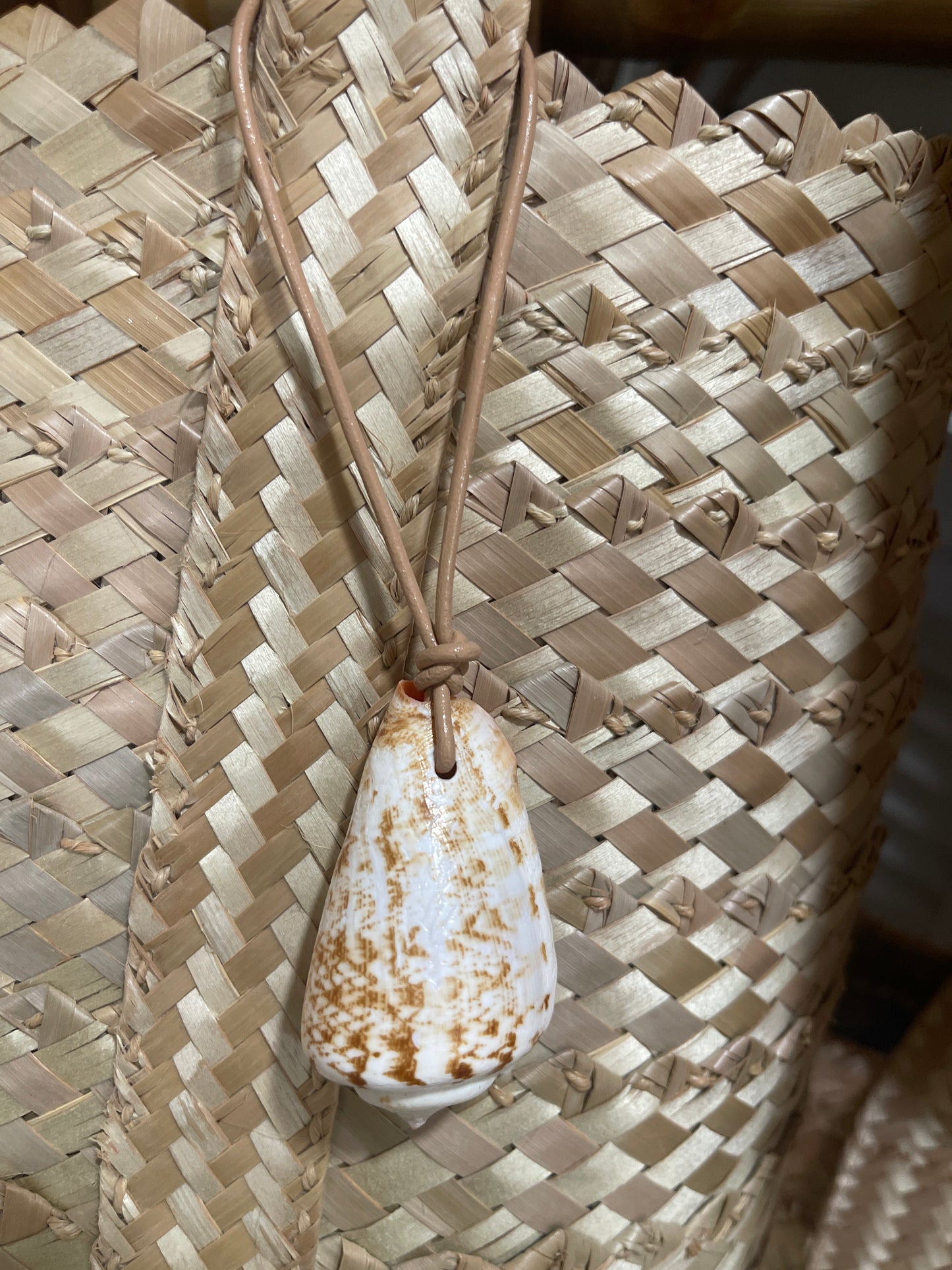 Shell + leather tassel