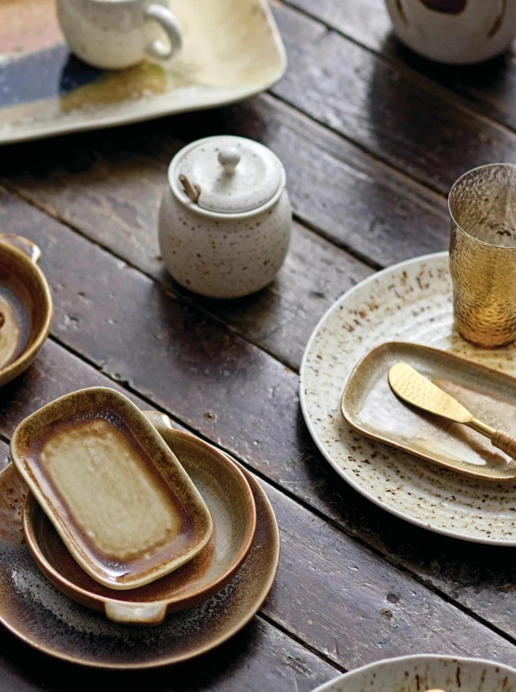 jar with gold spoon and lid