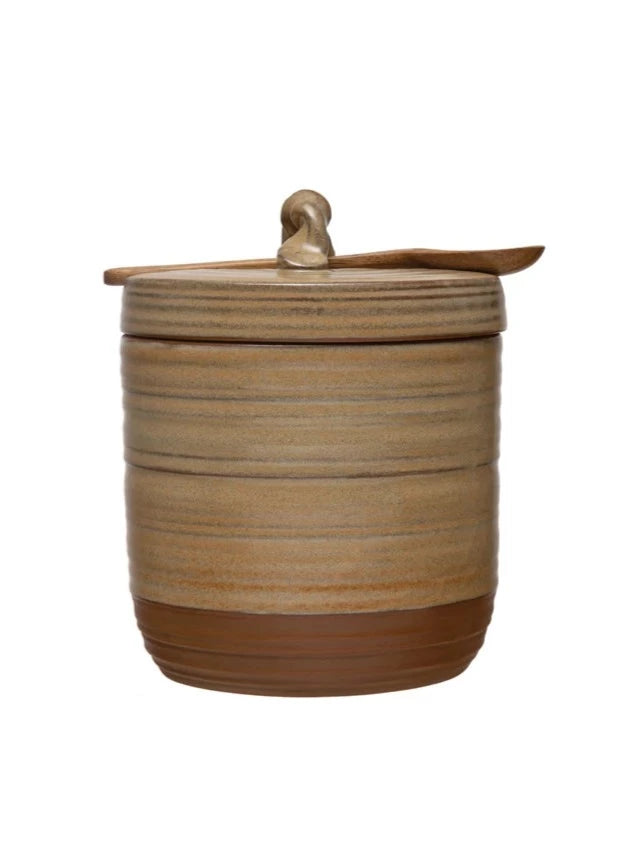 jar with lid and wooden spoon