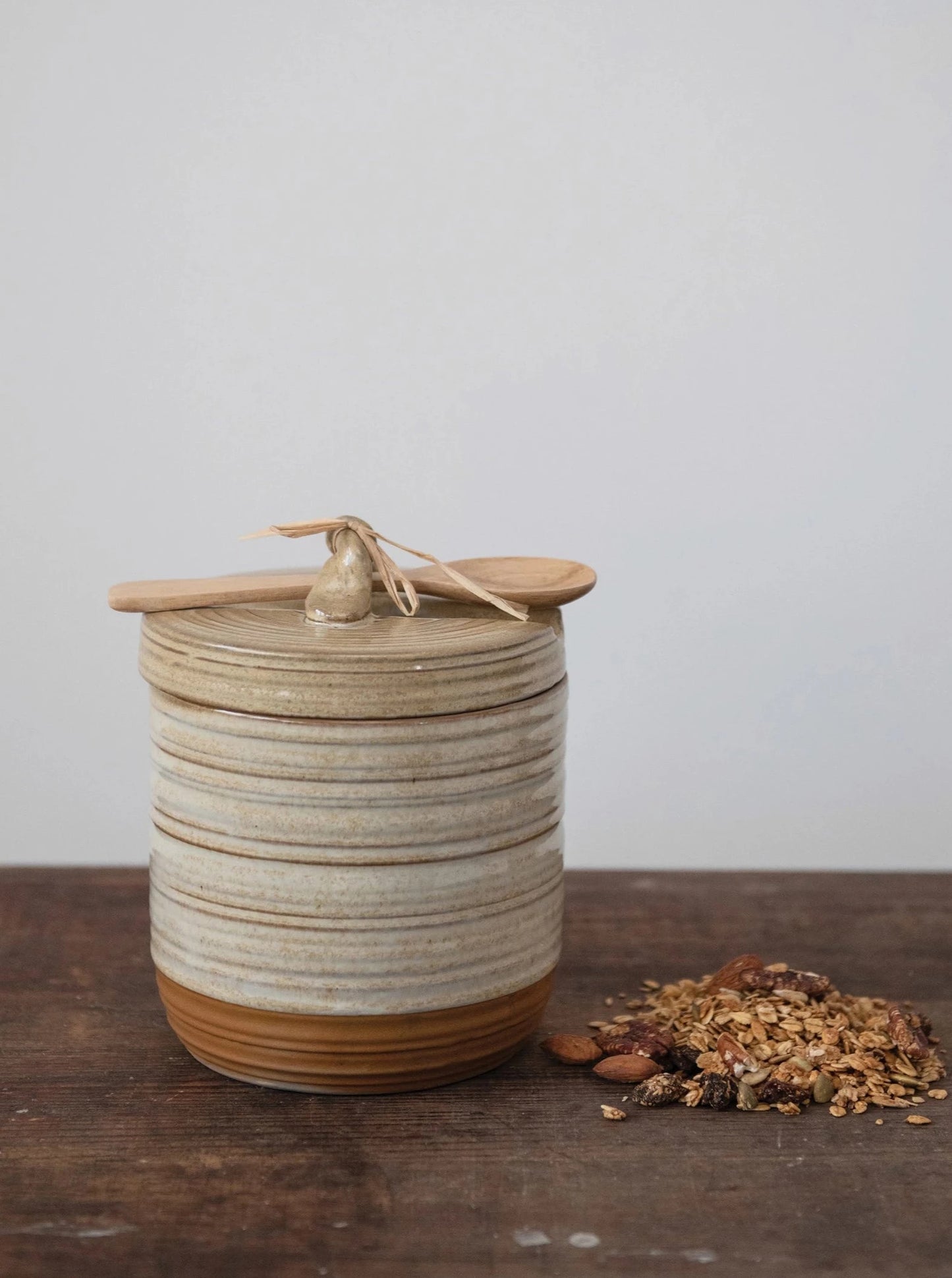 jar with lid and wooden spoon