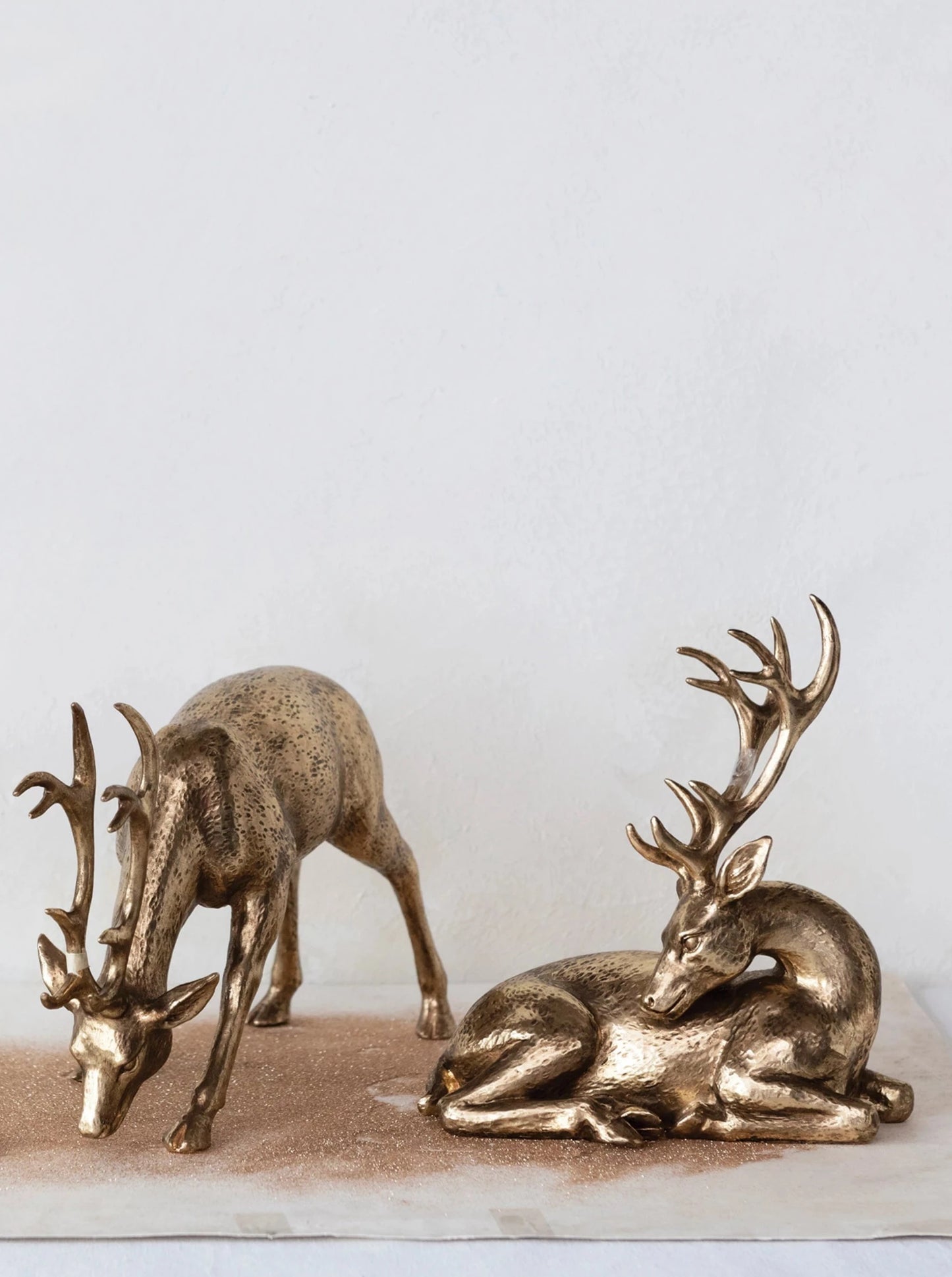 gold bowing deer